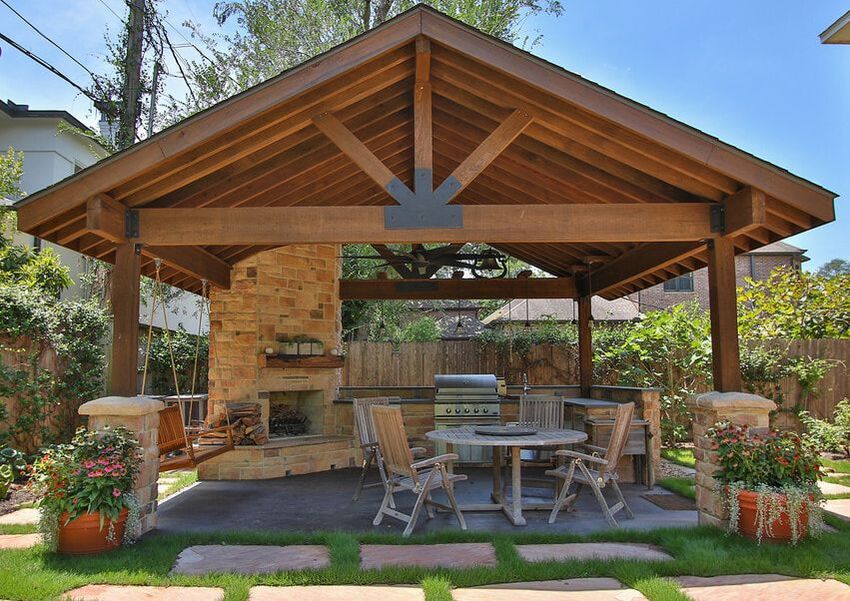 covered unattached pavilion with outdoor fireplace