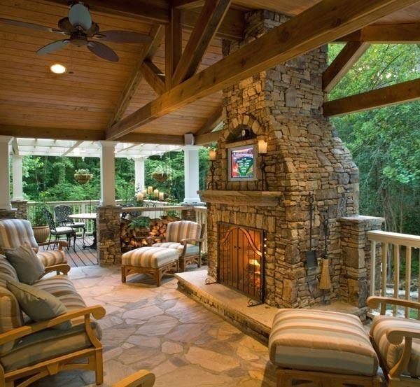 enclosed partially patio with outdoor stone masonry fireplace