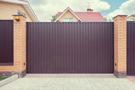 iron fencing with fine ashlar masonry columns with stone masonry foundations