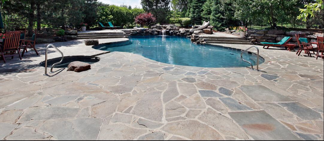 large stone masonry backyard patio