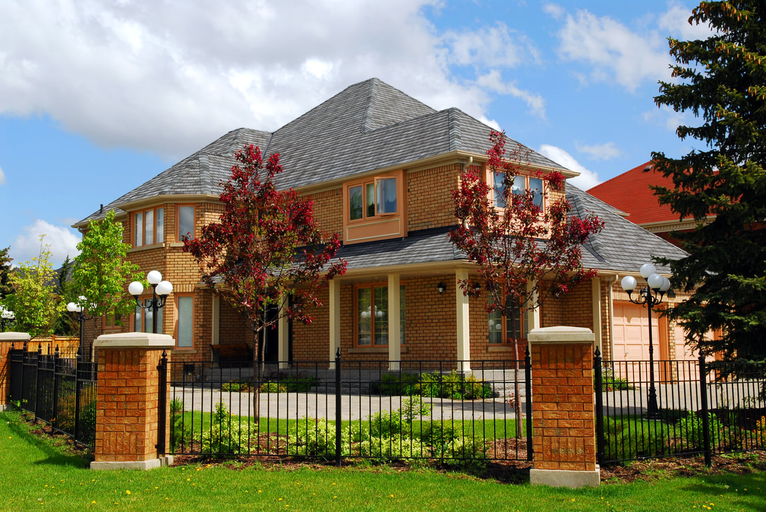 metal fence with brick masonry columns