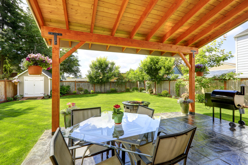 pergola over back stone patio